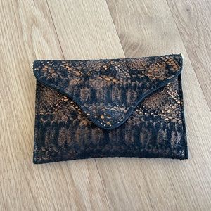 JJ Winters envelope bag with gold chain in black and copper sueded snakeskin.